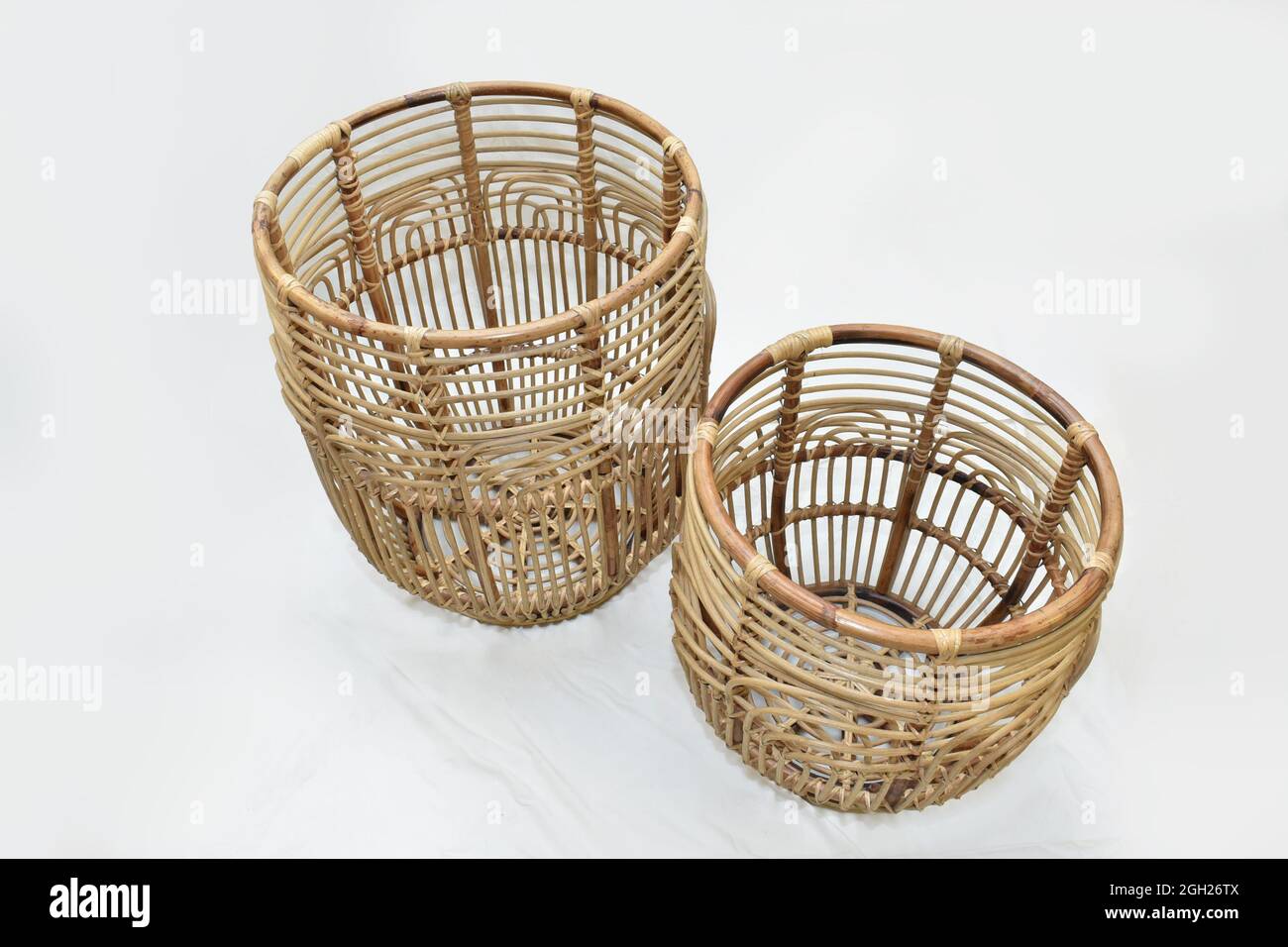 cane rattan Landry round basket set on white background selective soft focus Stock Photo