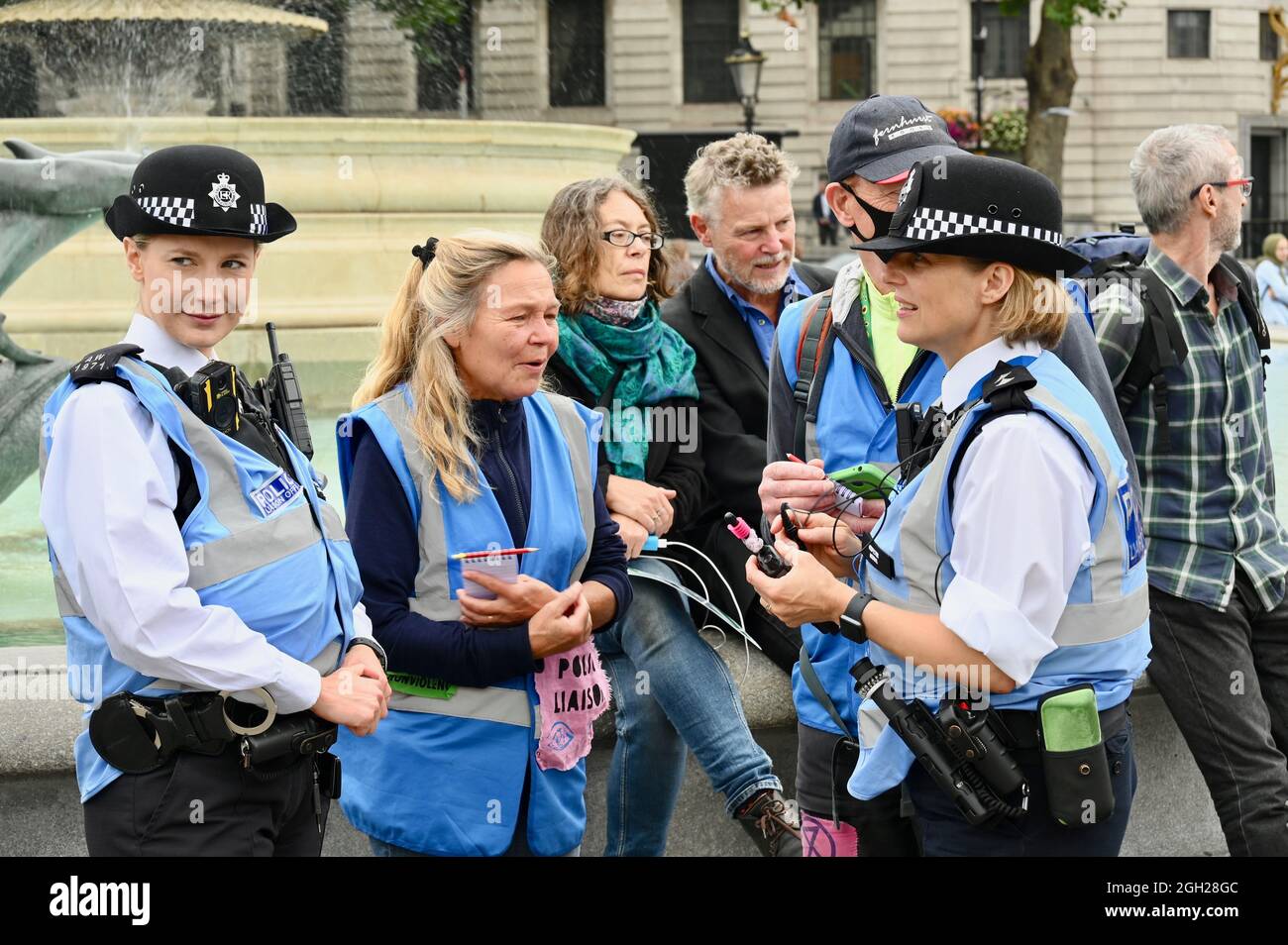 London, UK. Policewomen and activists from Extinction Rebellion gather in Trafalgar Square prior to the March for Nature : Rebel for Life which brings the series of demonstrations called 'Impossible Rebellion' to a close. Credit: michael melia/Alamy Live News Stock Photo
