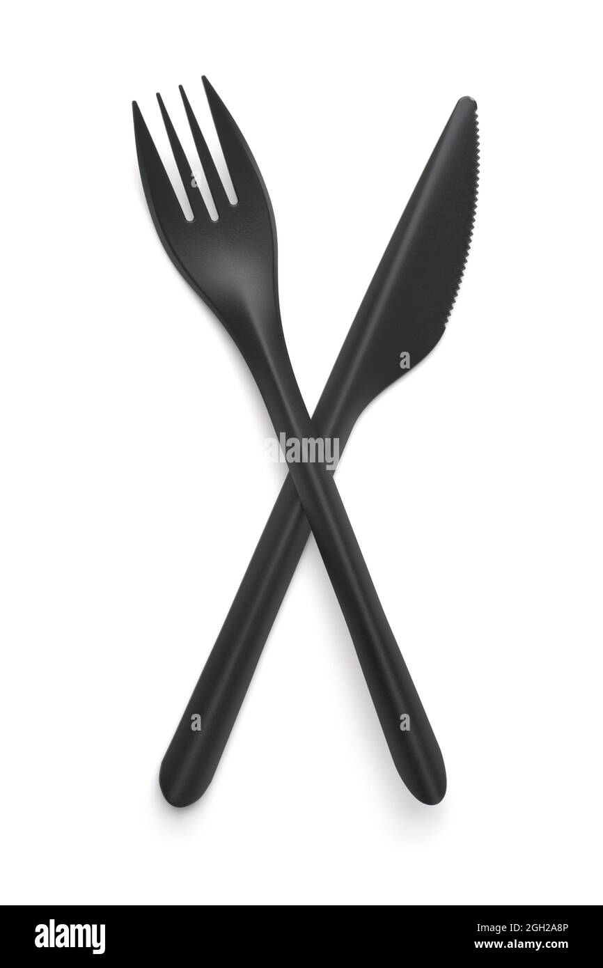 Top view of  black plastic disposable fork and knife isolated on white Stock Photo