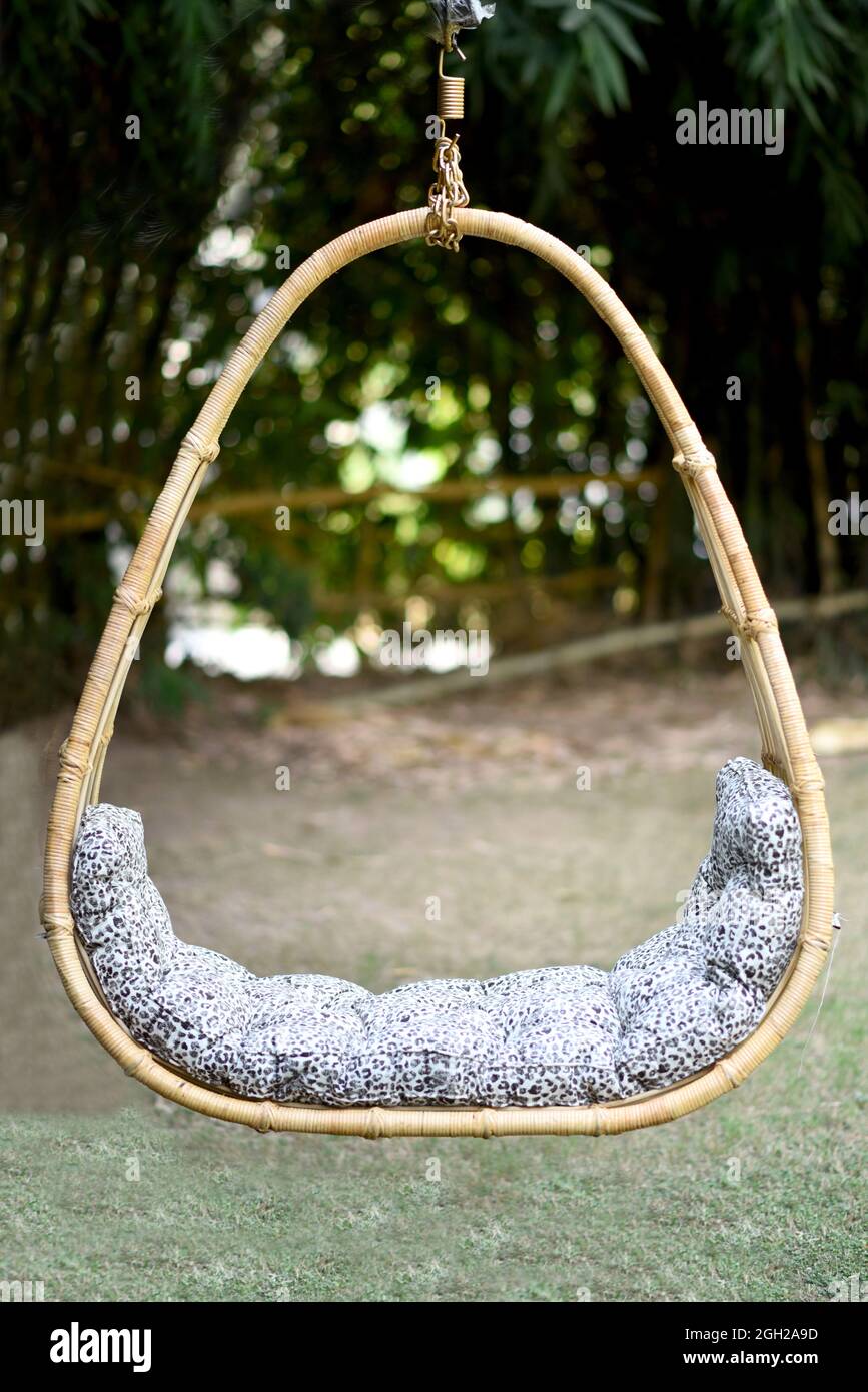 beautiful cane hammock with cushion outdoor background selective soft focus Stock Photo Alamy
