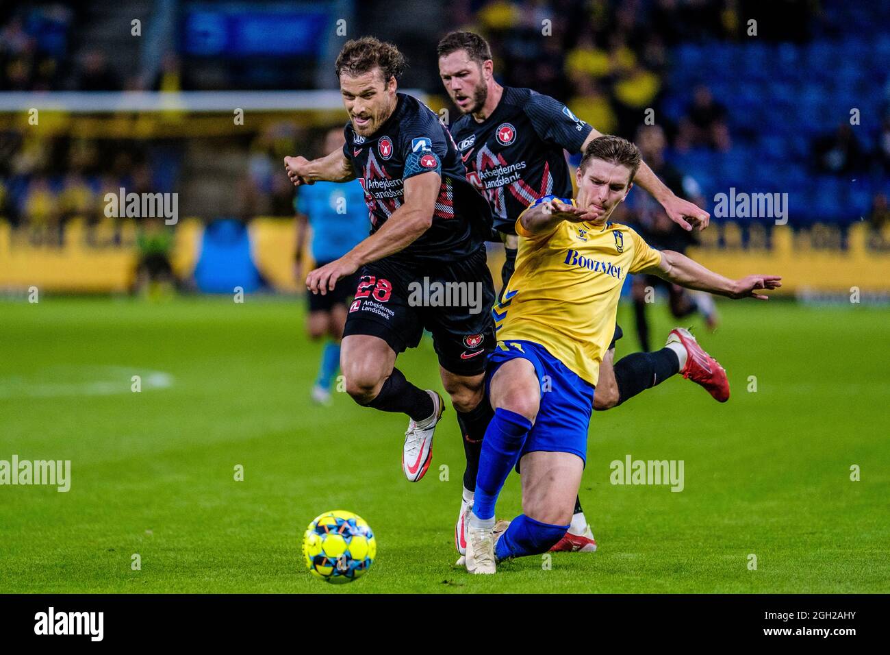 Brondby, Denmark. 29th, August 2021. Mikael Uhre (11) Broendby IF and Erik Sviatchenko (28) of FC Midtjylland seen during the 3F Superliga match between Broendby IF and Midtjylland at Brondby
