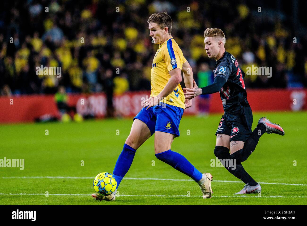 Brondby, Denmark. 29th, August 2021. Mikael Uhre (11) of Broendby IF and Charles  (35) of FC Midtjylland seen during the 3F Superliga match between Broendby IF and FC Midtjylland at Brondby Stadion. (Photo credit: Gonzales Photo - Robert Hendel). Stock Photo