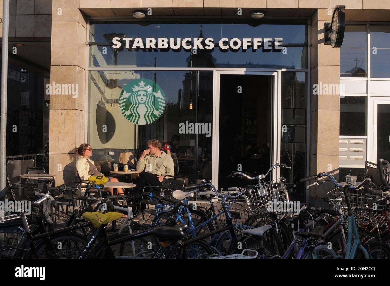 Copenhagen, Denmark.,04 September 2021 /Starbucks coffee cafe guest enjopy sun shine a summeer