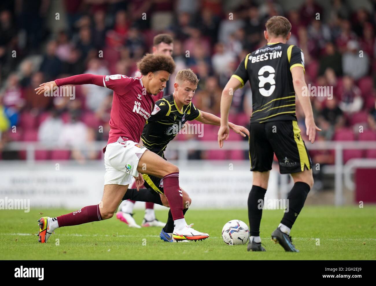 Northampton, UK. 04th Sep, 2021. Harry Wood (on loan from Hull City) of Scunthorpe United & Shaun McWilliams of Northampton Town during the Sky Bet League 2 match between Northampton Town and Scunthorpe United at Sixfields Stadium, Northampton, England on 4 September 2021. Photo by Andy Rowland. Credit: PRiME Media Images/Alamy Live News Stock Photo