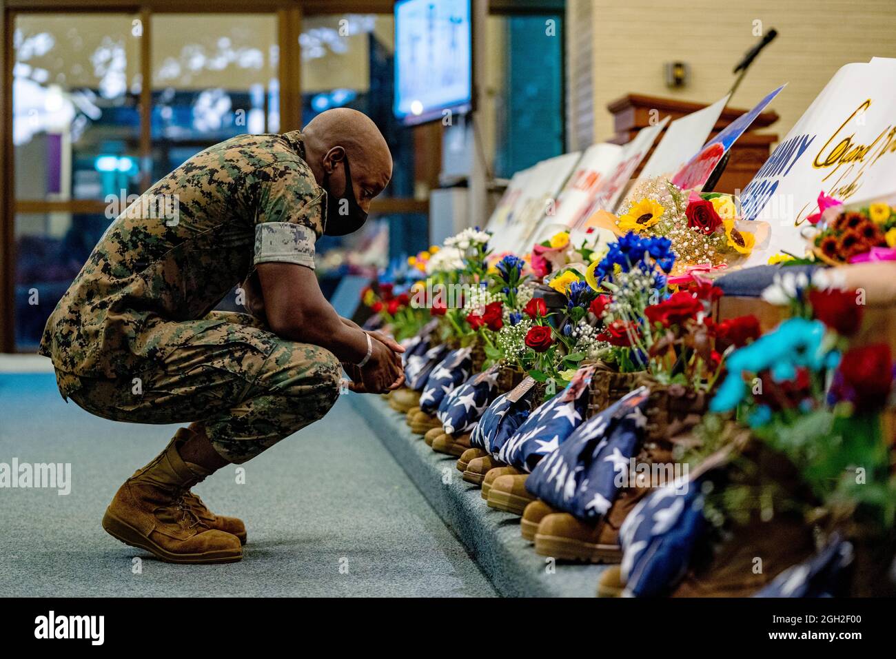 Camp Foster, Japan. 03rd Sep, 2021. A U.S. Marine mourns during a memorial service for the 13 service members killed during the evacuation of Kabul at Camp Foster September 2, 2021 in Okinawa, Japan. Credit: Cpl. Brennan Beauton/US Marines Photo/Alamy Live News Stock Photo