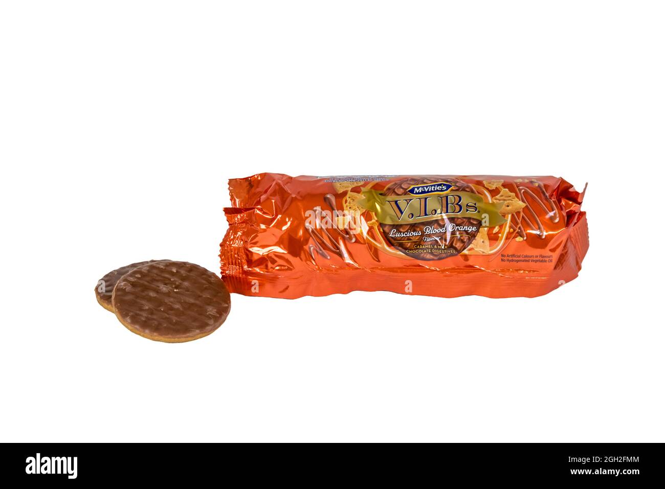 An opened packet of McVitie's Luscious Blood Orange flavoured caramel & chocolate biscuits with two biscuits next to the packet. Stock Photo