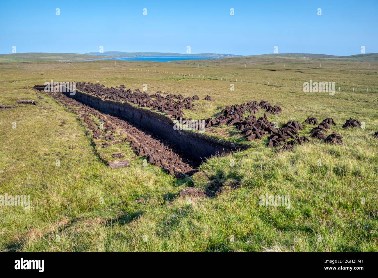 An area of fresh peat digging near Mid Yell on the island of Yell, Shetland. Stock Photo