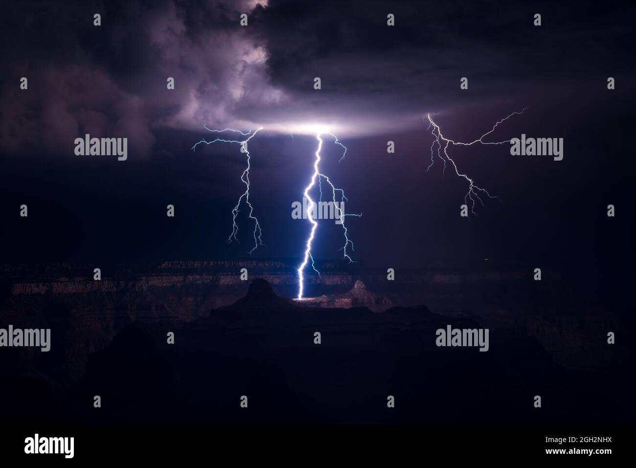 Lightning strike in the Grand Canyon as a monsoon storm drifts through Grand Canyon National Park, Arizona, USA Stock Photo