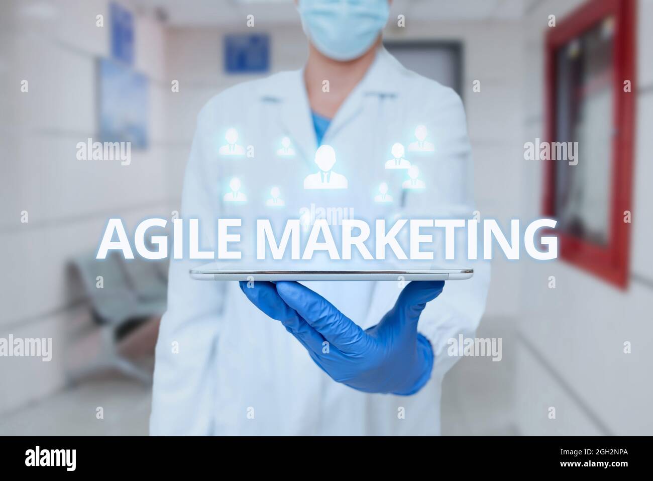 Conceptual caption Agile Marketing. Word for focusing team efforts that deliver value to the endcustomer Man In Uniform Standing Holding Tablet Stock Photo