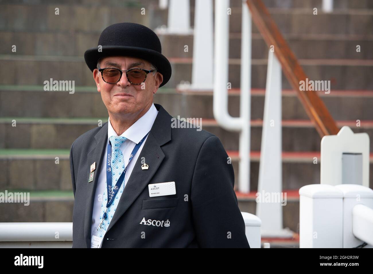 Ascot, Berkshire, UK. 4th September, 2021. One of the smart stewards at Ascot Races wears a bowler hat. Credit: Maureen McLean/Alamy Live News Stock Photo