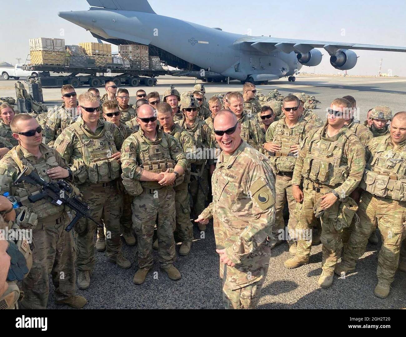 Maj. Gen. John Rhodes, Task Force Spartan and 29th Infantry Division commanding general, welcomes Soldiers from the Minnesota-based 34th Infantry Division, Aug. 31, 2021, shortly after their planes landed in Kuwait. Known as the Red Bulls - the National Guard Soldiers were some of the last American servicemembers to leave Afghanistan. Stock Photo