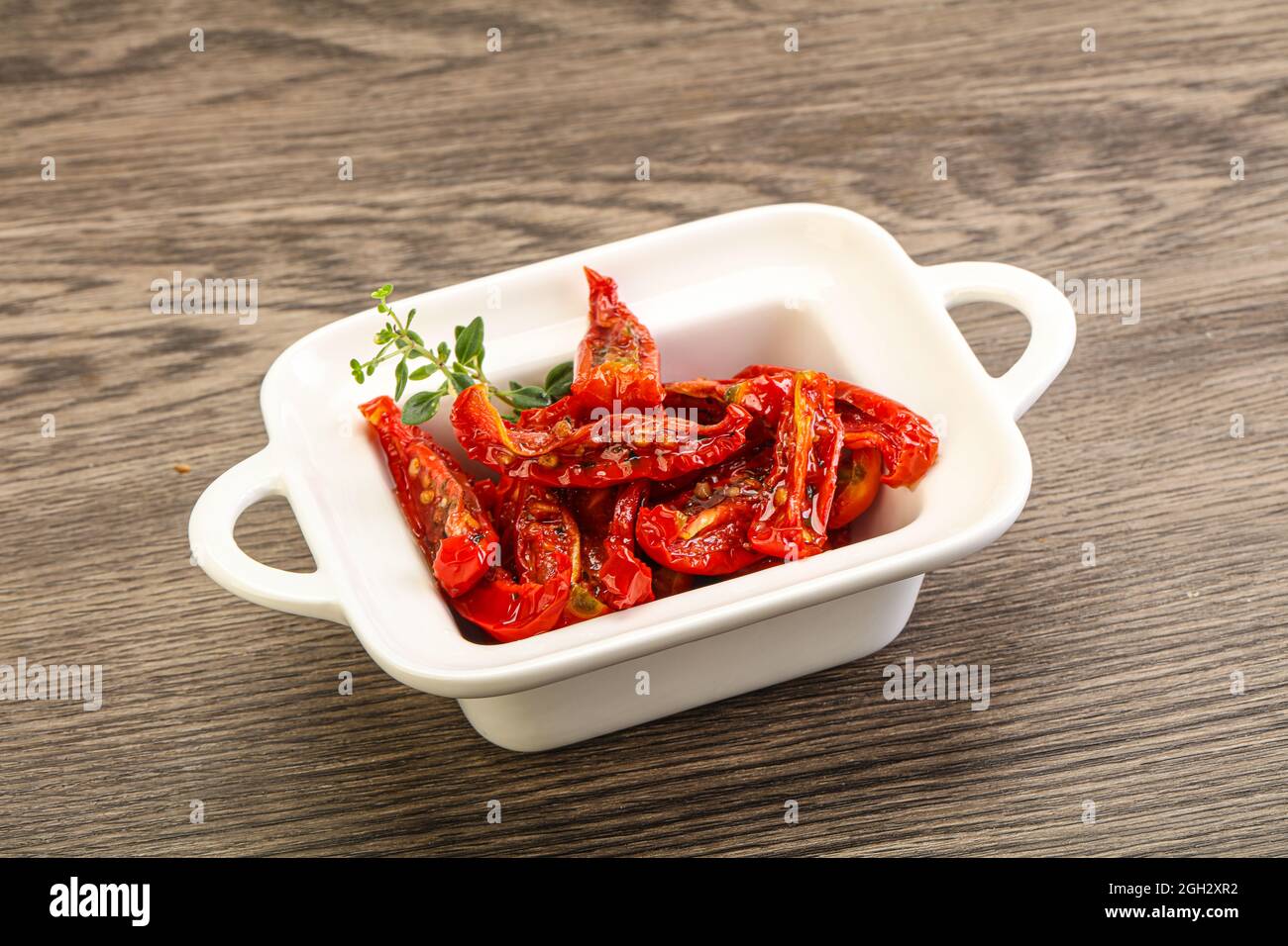 Sundried tomato in olive oil with herbs and spices Stock Photo Alamy