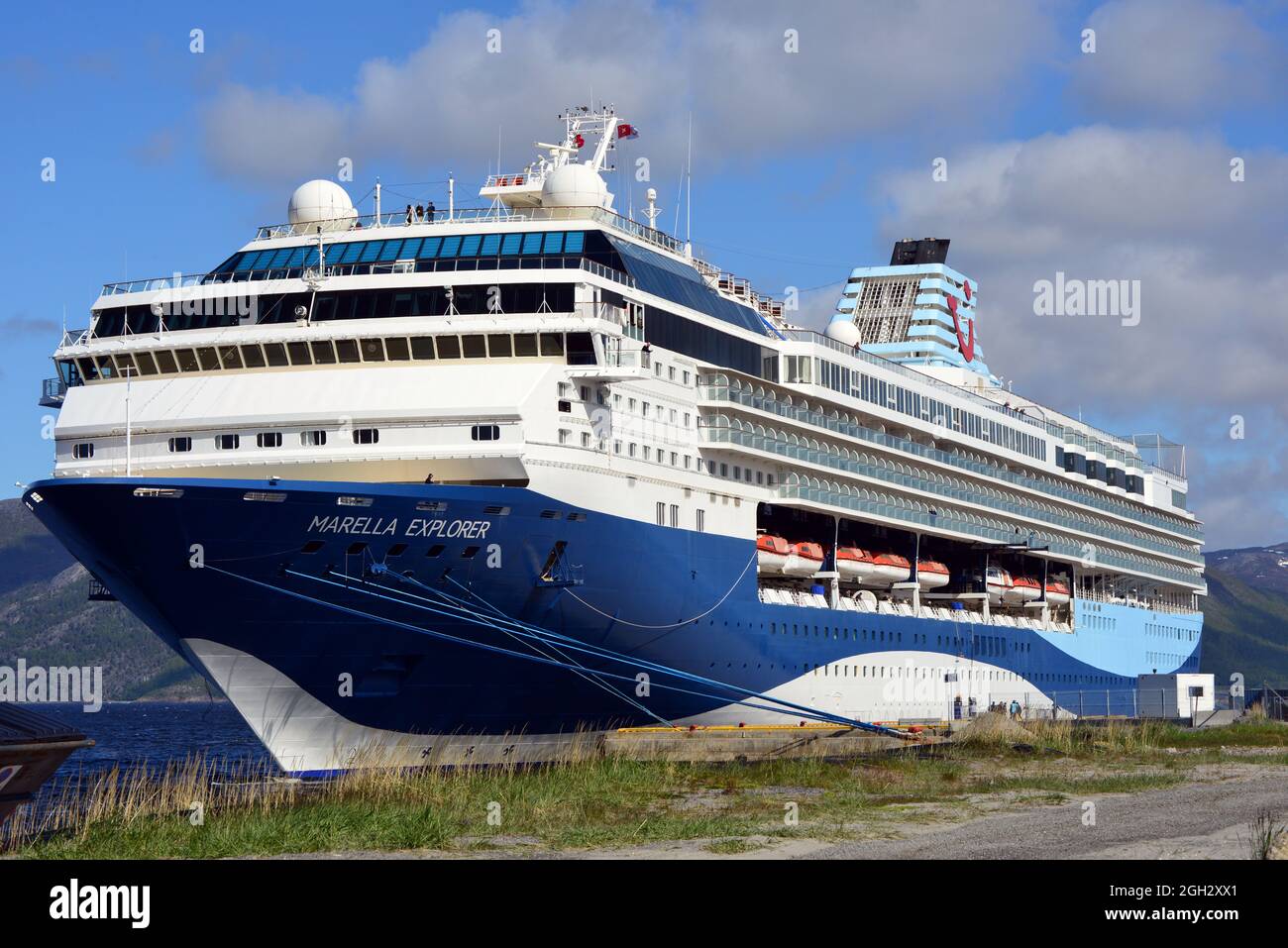 The cruise ship Marella Explorer moored in the harbour of Alta, northern Norway on a sunny day in June. Stock Photo