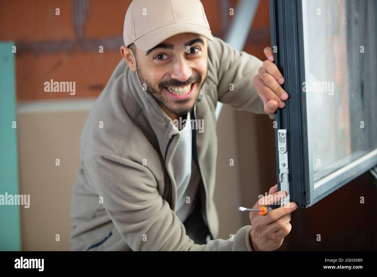 youg hapy window installation worker Stock Photo