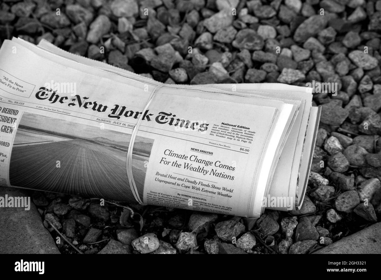 A home delivered copy of a Sunday New York Times newspaper in front of a home in Santa Fe, New Mexico. Stock Photo