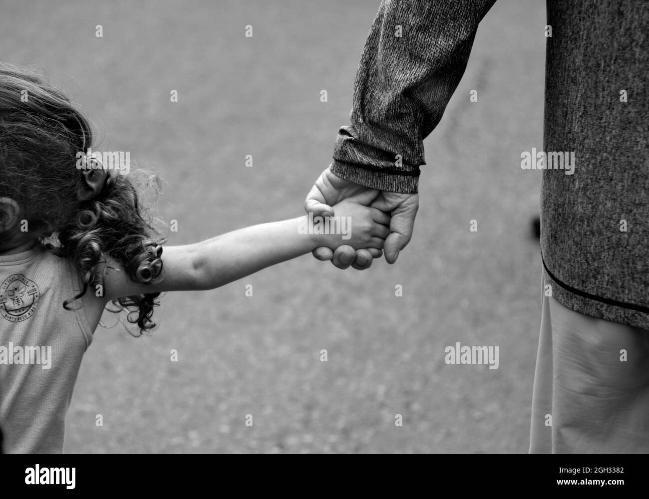 black and white kids holding hands