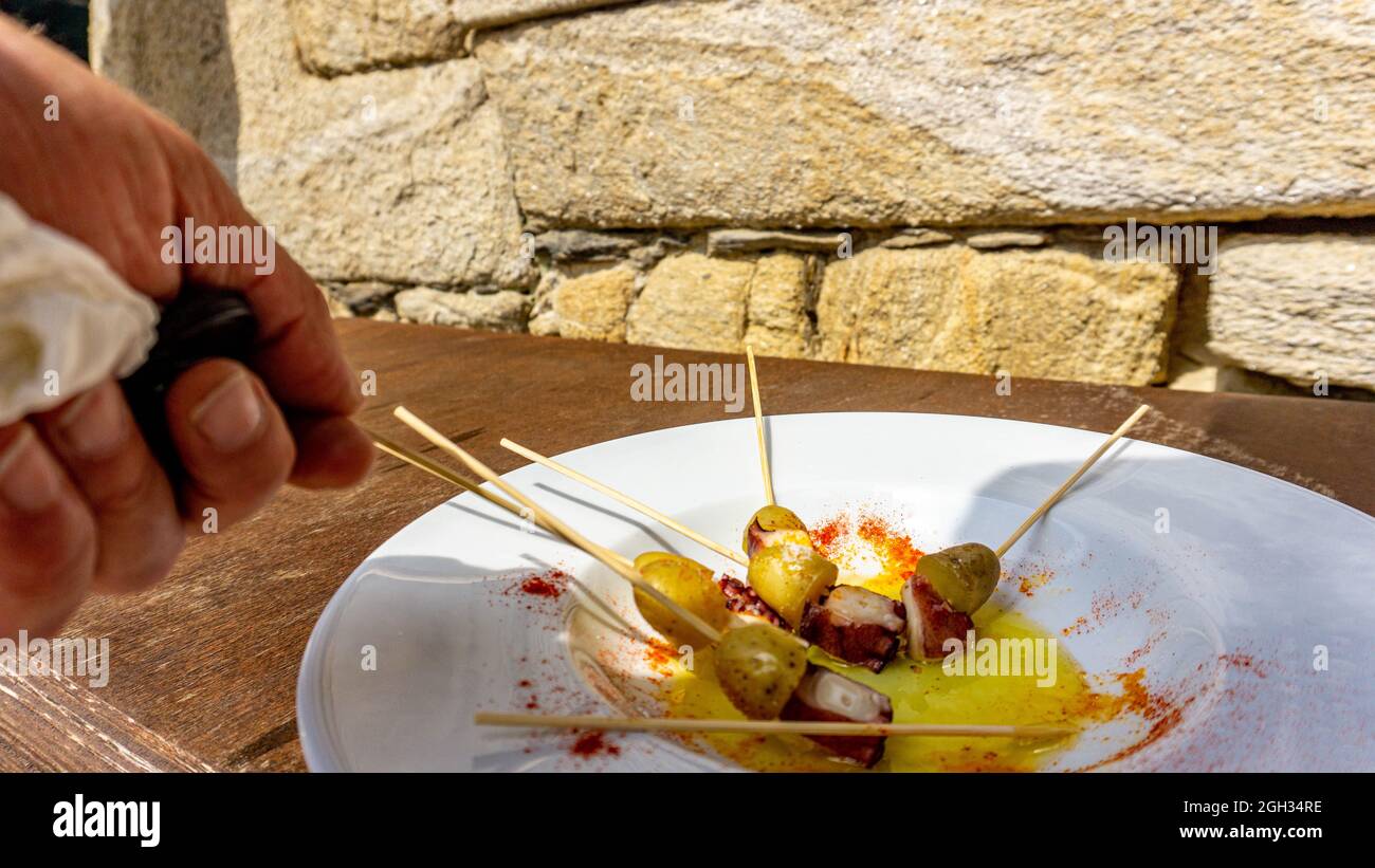 white plant with skewers octopus tea with potato Stock Photo