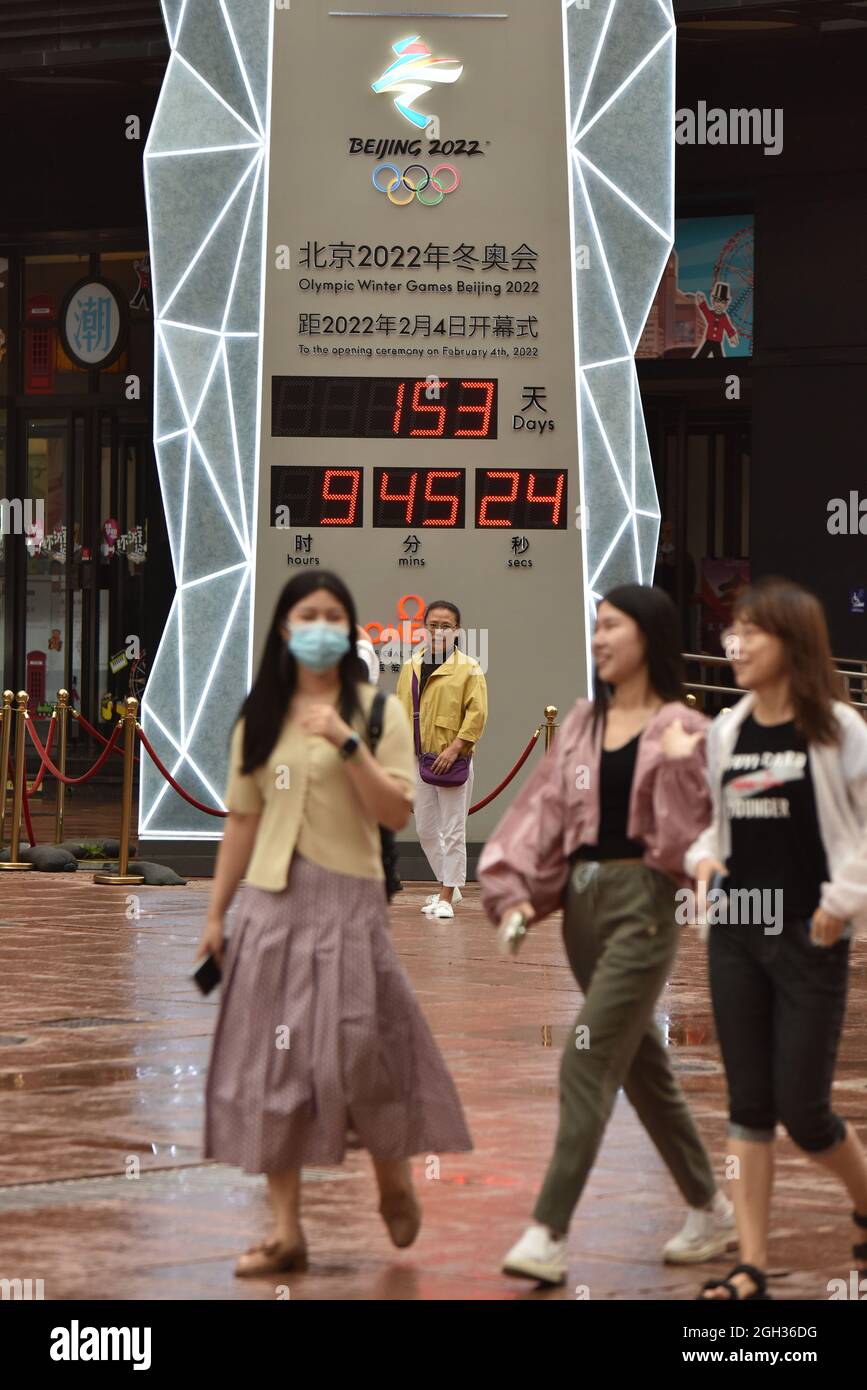 Beijing, China. 04th Sep, 2021. People walk past a countdown board for the  2022 Beijing Winter Olympics on Wangfujing Street in Beijing.There are 153  days left before the 2022 Beijing Winter Olympics