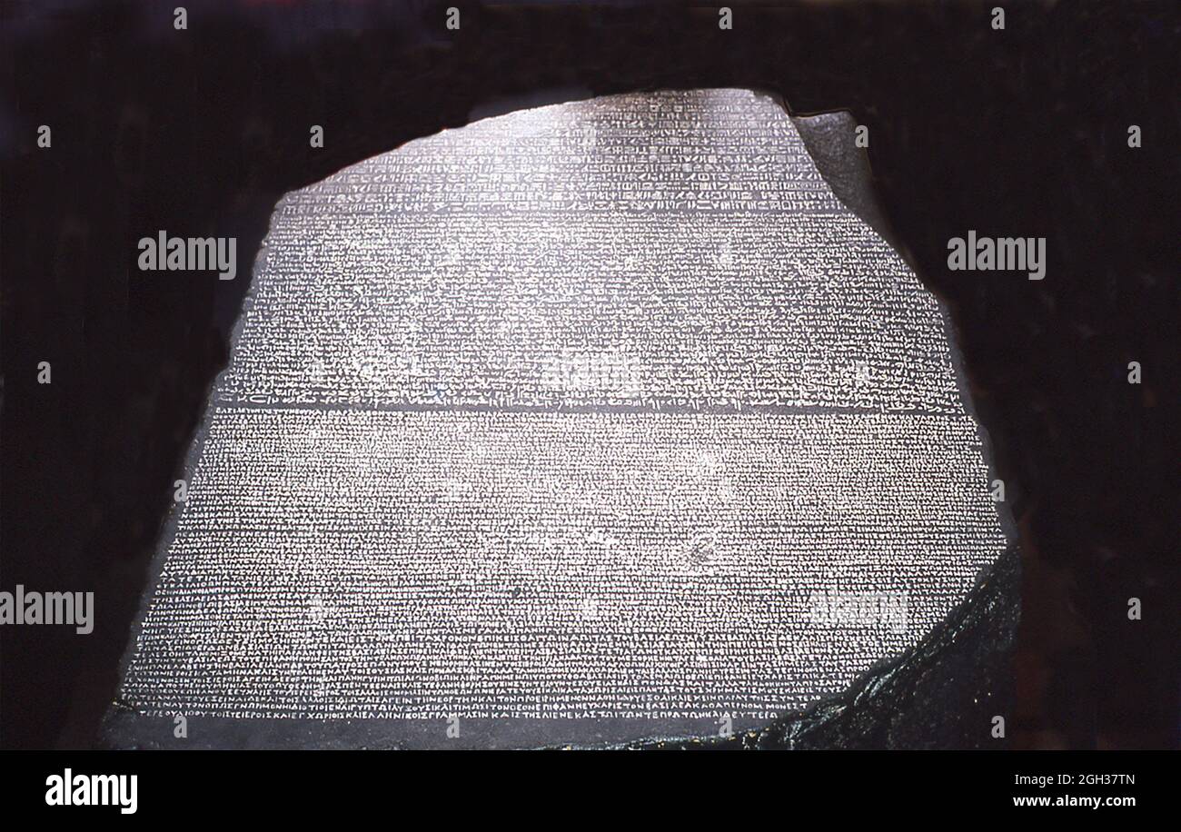This photo of the Rosetta Stone in the British Museum dates to 1992. Rosetta Stone refers to an ancient Egyptian stone that has inscriptions in several languages and scripts. Their decipherment (credited to French Egyptologist Jean-Francois Champollion) led to the understanding of hieroglyphic writing. The stone is an irregularly shaped stone of black granite 3 feet 9 inches long and 2 feet 4.5 inches wide. It was broken in antiquity, it was found near the town of Rosetta, northeast of Alexandria. It was discovered by a Frenchman named Bouchard or Boussard in August 1799. After the French surr Stock Photo