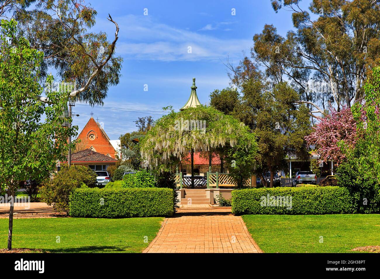 Robertson park in Mudgee shire town on the main street - fresh springtime green with blooming trees. Stock Photo