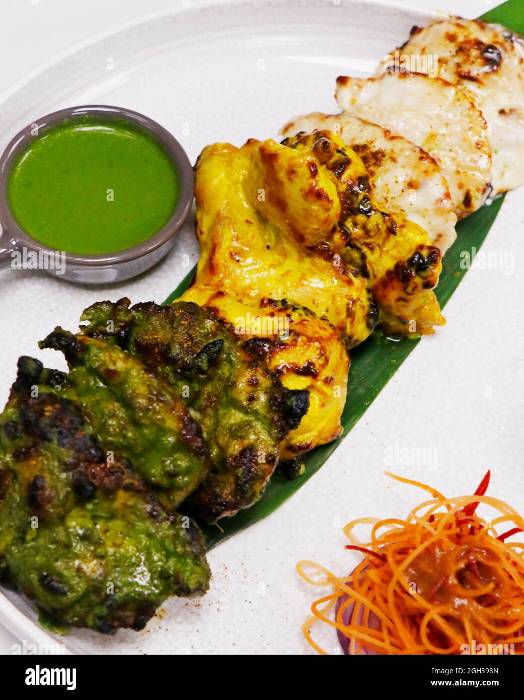 indian food speciality flavored tandoori chicken tikka, cream, saffron