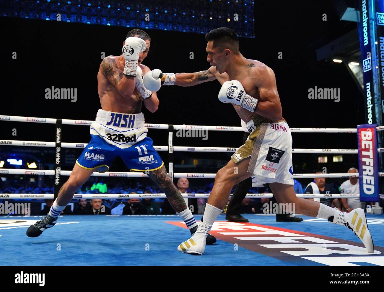 Josh Warrington (left) and Mauricio Lara in their International Featherweight contest contest during the boxing event at the Emerald Headingley Stadium, Leeds. Picture date: Saturday September 4, 2021. Stock Photo