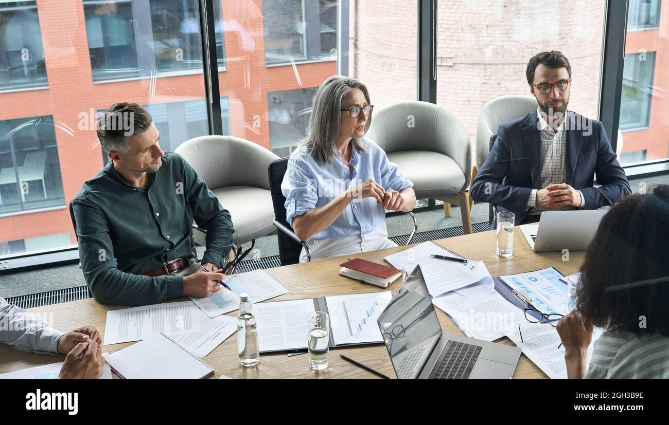 Executive business team people discuss project at meeting in board room. Stock Photo