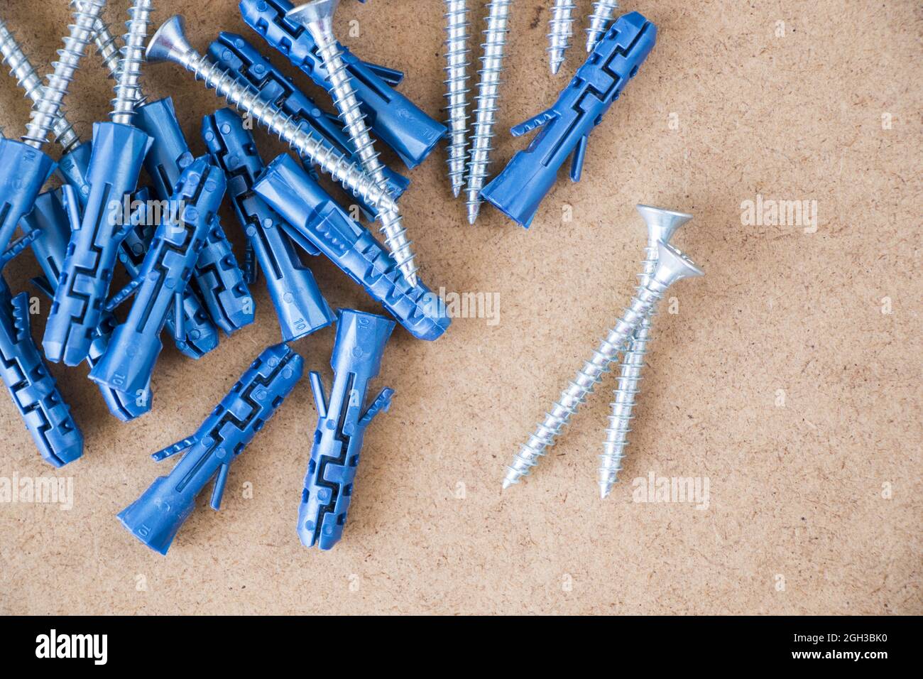 Wall plugs and screws on the brown background Stock Photo Alamy