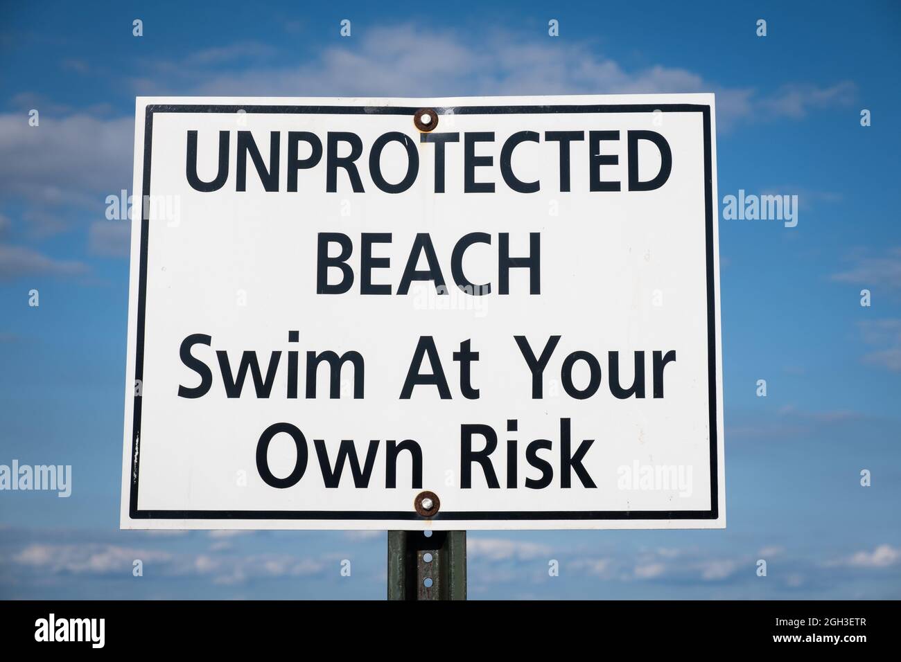Unprotected Beach sign USA Stock Photo