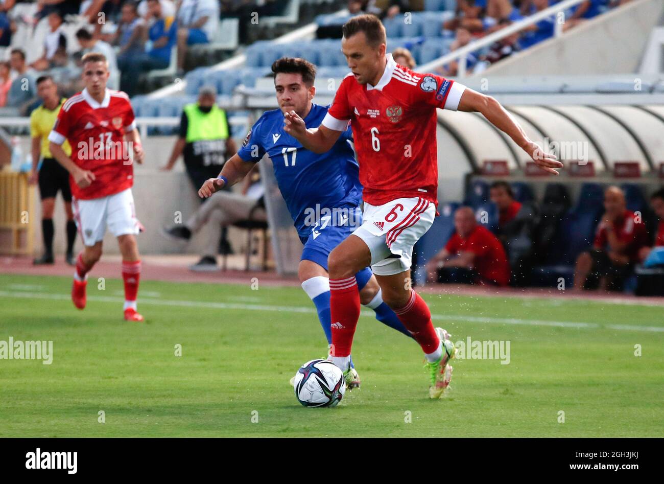 Nicosia, Cyprus. 4th Sep, 2021. Denis Cheryshev (R) of Russia vies with Loizos Loizou (2nd R) of Cyprus during the FIFA World Cup Qatar 2022 European Qualifiers Group H football match between Cyprus and Russia in Nicosia, Cyprus, Sept. 4, 2021. Credit: George Christophorou/Xinhua/Alamy Live News Stock Photo