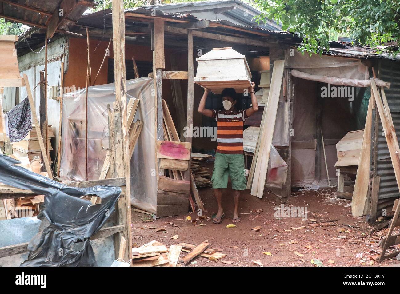 Colombo, Sri Lanka. 04th Sep, 2021. A man carry coffin at a funeral