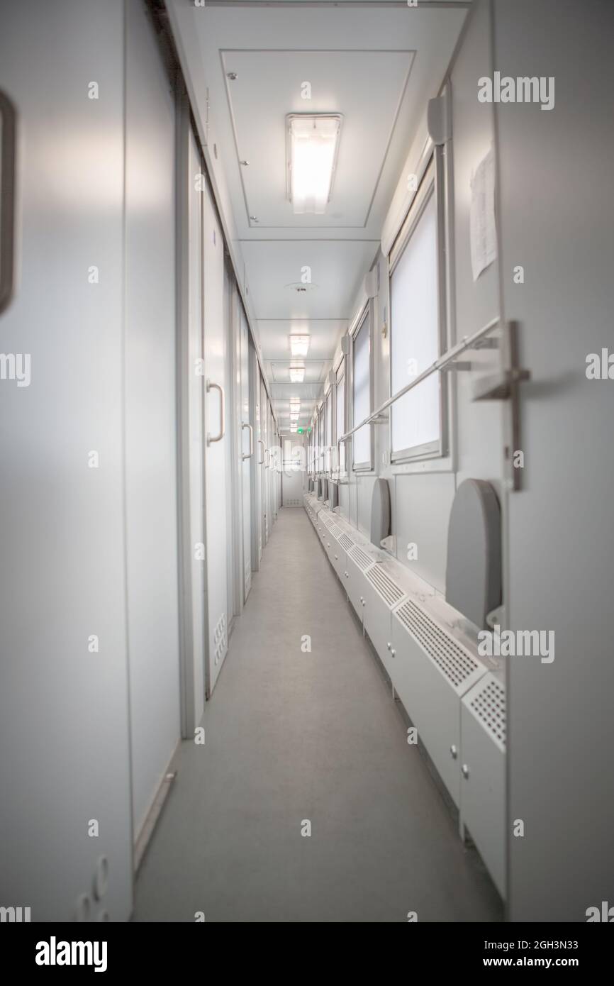 classic interior of sleeping car of train. interior of compartment car. Passenger train car. Sleeping car of passenger train Stock Photo