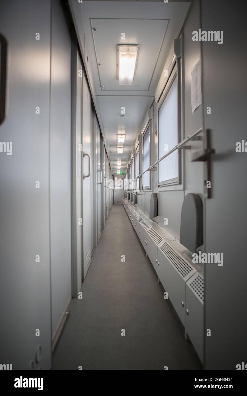 classic interior of sleeping car of train. interior of compartment car. Passenger train car. Sleeping car of passenger train Stock Photo