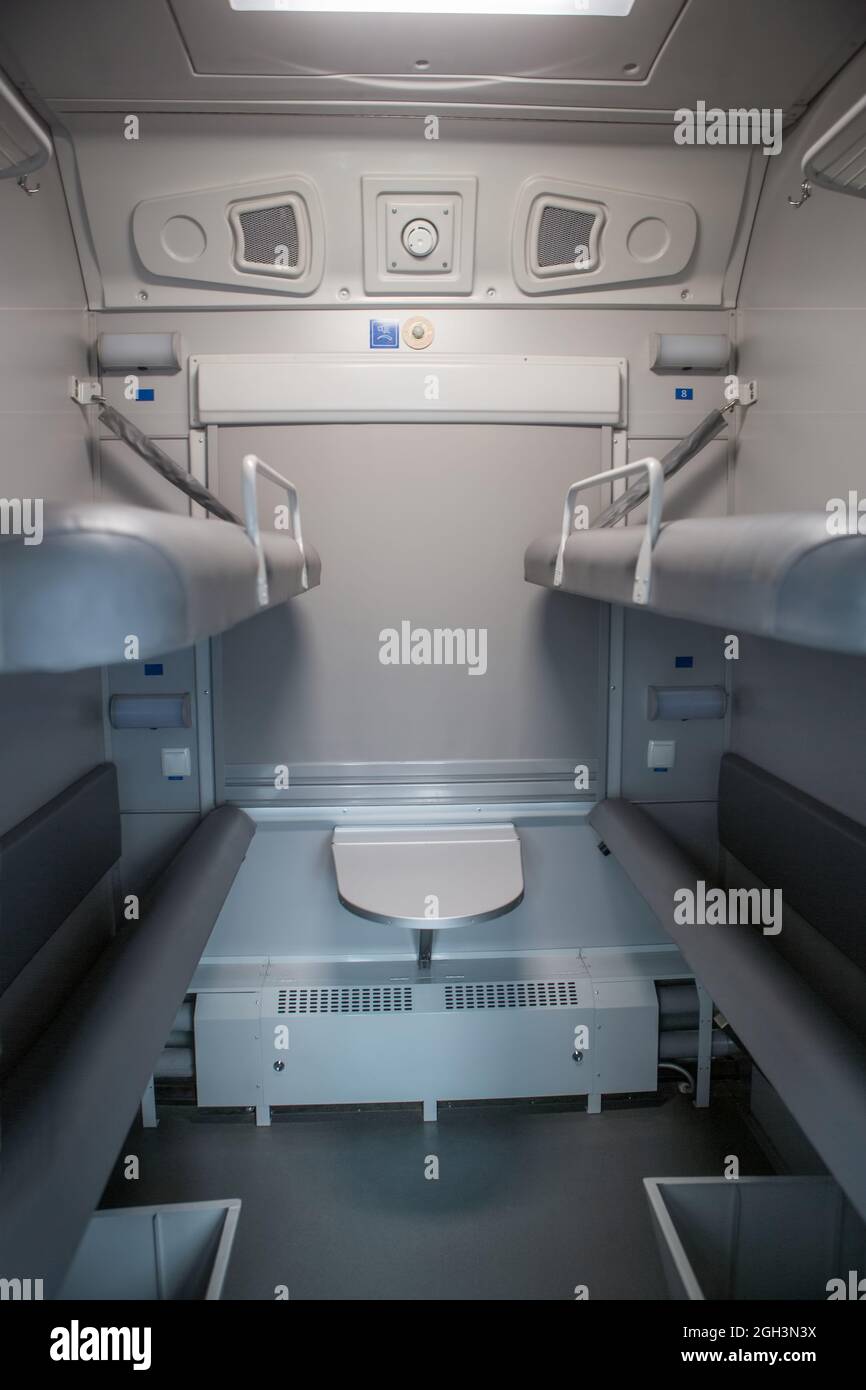 classic interior of sleeping car of train. interior of compartment car. Passenger train car. Sleeping car of passenger train Stock Photo
