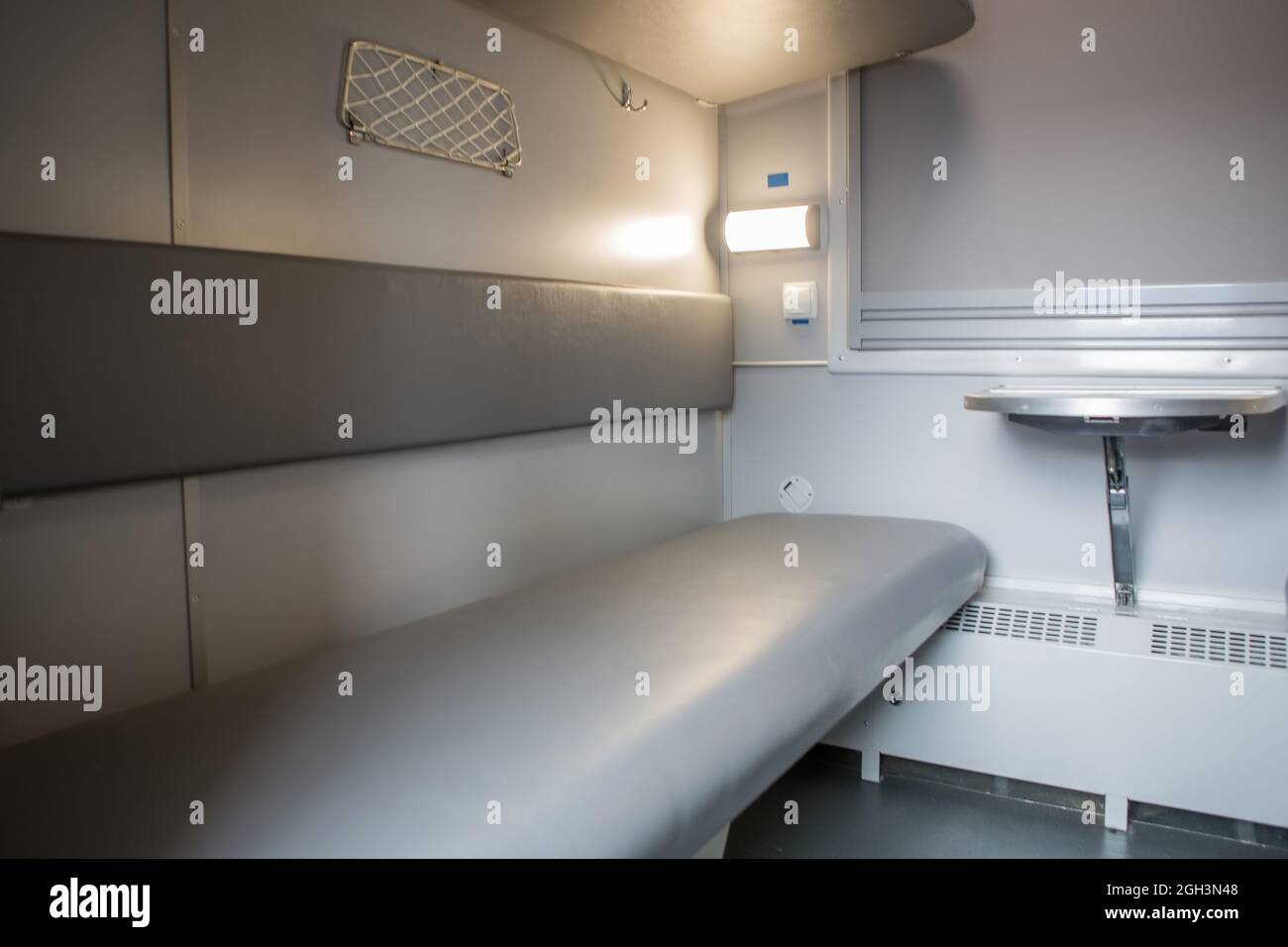 classic interior of sleeping car of train. interior of compartment car. Passenger train car. Sleeping car of passenger train Stock Photo