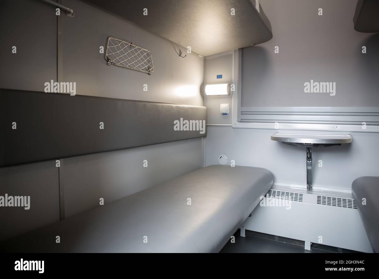 classic interior of sleeping car of train. interior of compartment car. Passenger train car. Sleeping car of passenger train Stock Photo