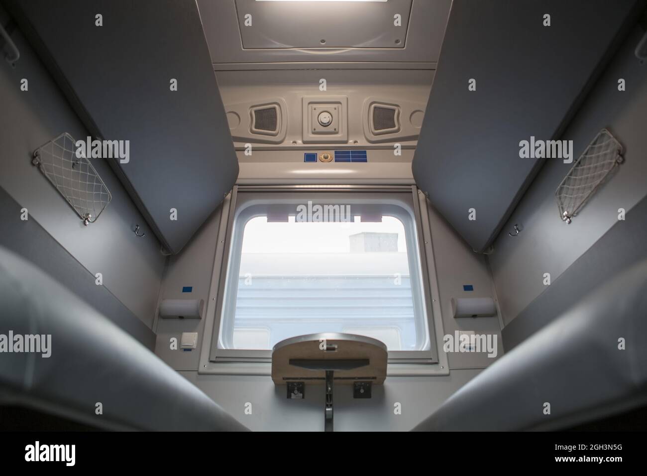 classic interior of sleeping car of train. interior of compartment car. Passenger train car. Sleeping car of passenger train Stock Photo