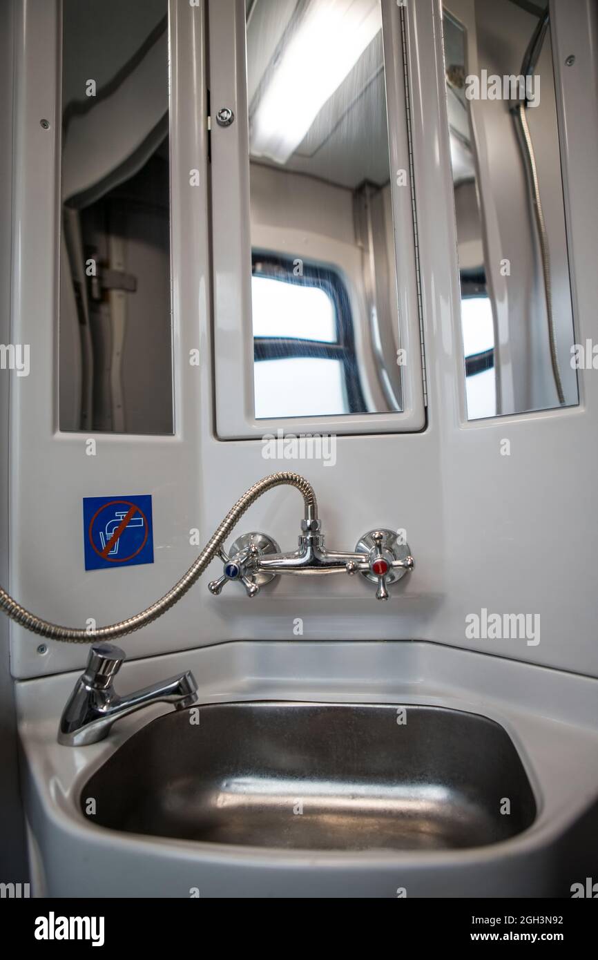 Classic toilet interior on the train. Toilet in the passenger train