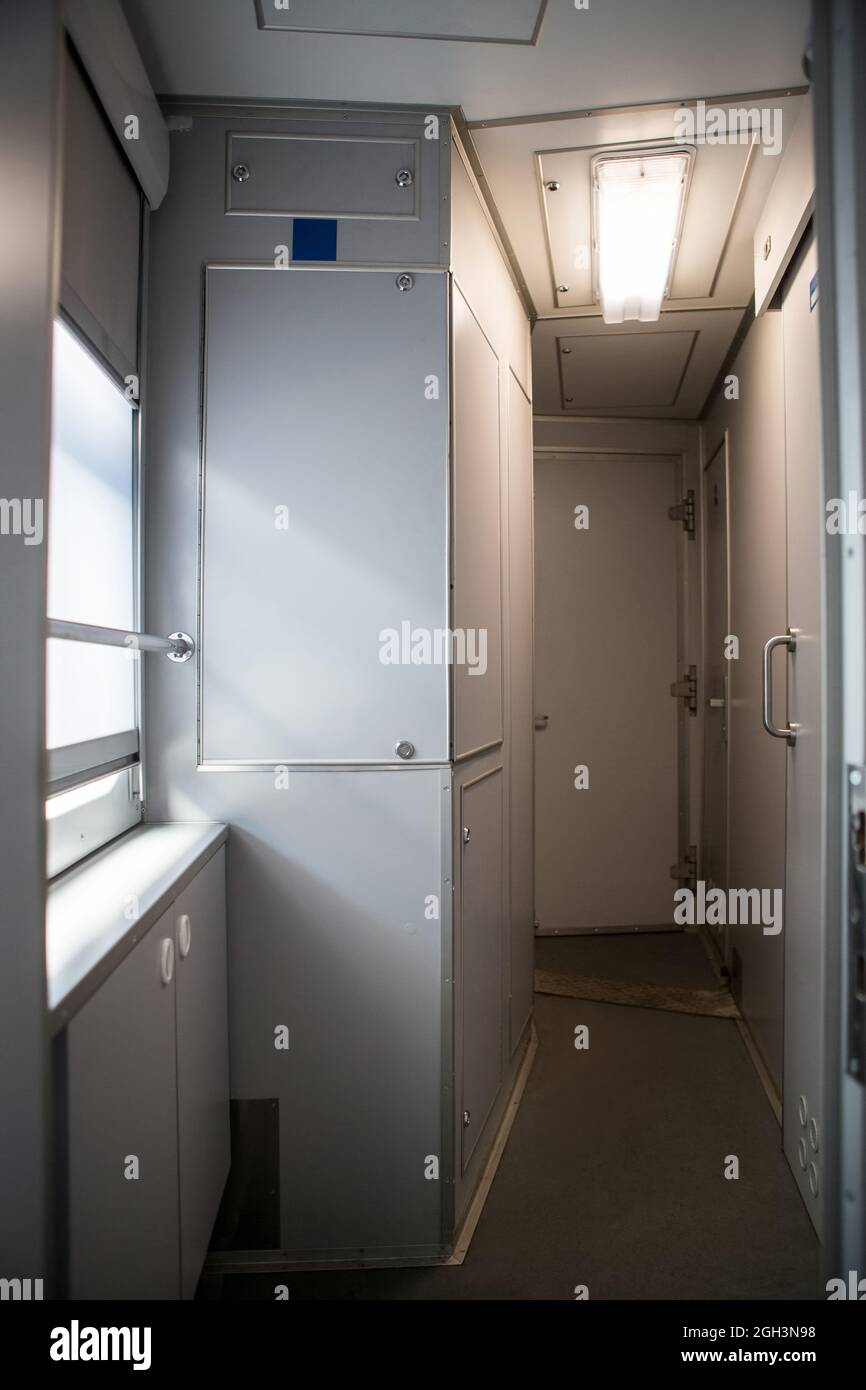 classic interior of sleeping car of train. interior of compartment car. Passenger train car. Sleeping car of passenger train Stock Photo