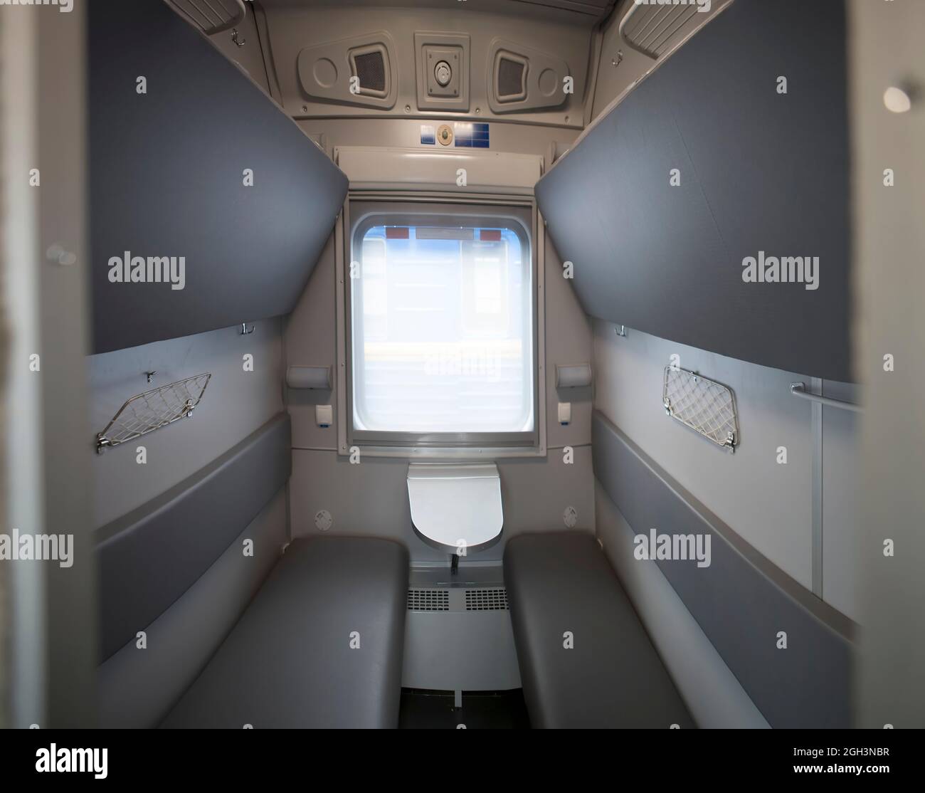 classic interior of sleeping car of train. interior of compartment car. Passenger train car. Sleeping car of passenger train Stock Photo