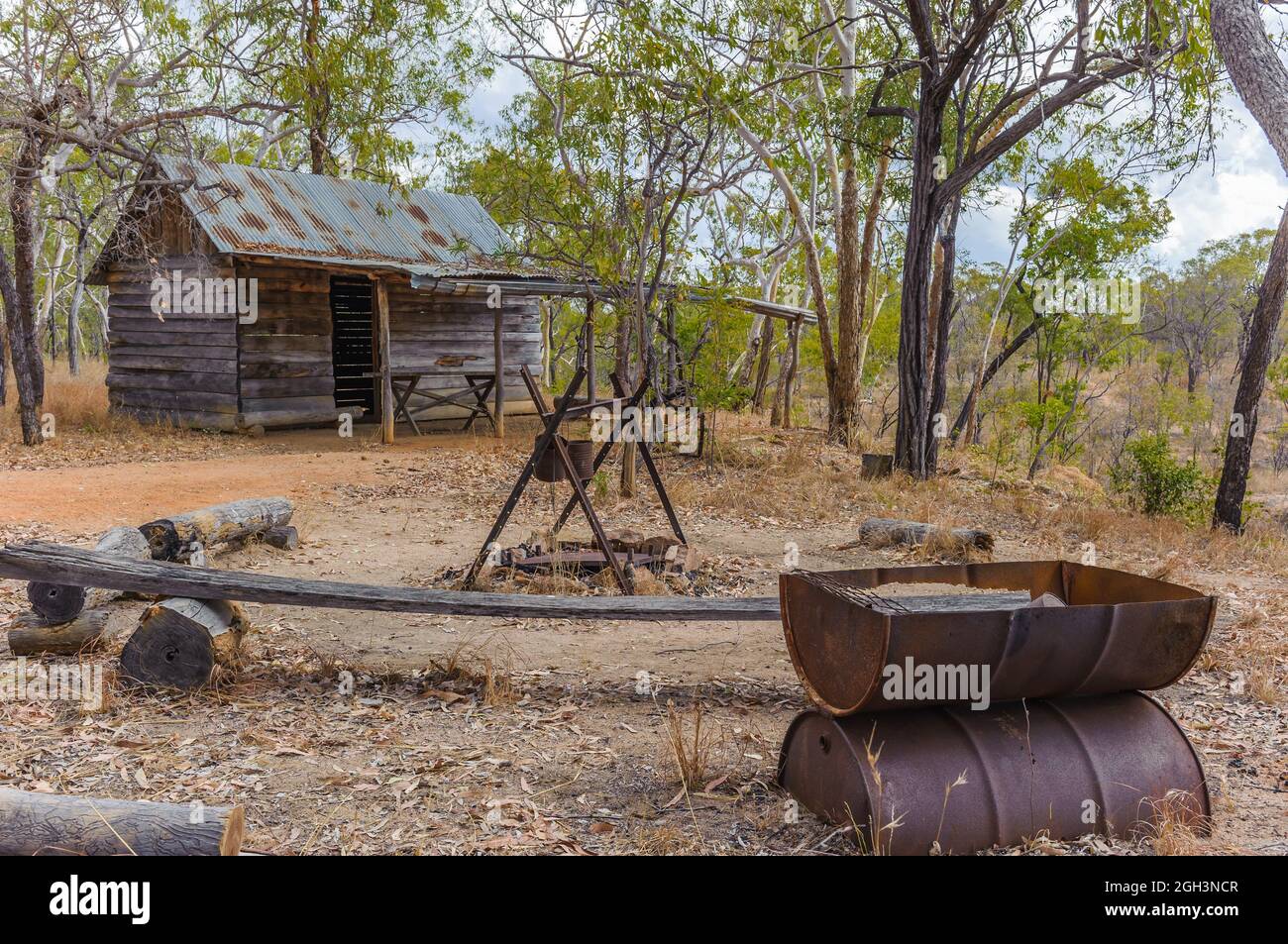A replica old early pioneer log cabin and traditional outback, outdoor kitchen at Undara, North-west Queensland in Australia. Stock Photo