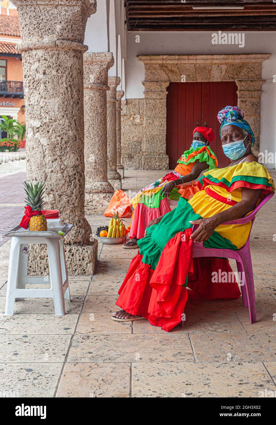 Palenqueras, traditional fruit vendors, during Covid-19 pandemic, Cartagena de Indias, Colombia. Stock Photo