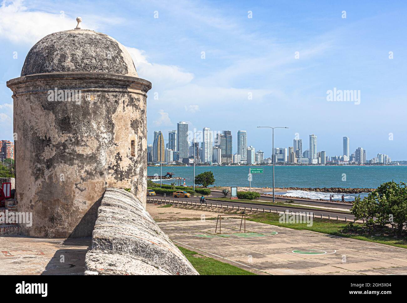 Colonial wall and turret overlooking the modern part of the city, Cartagena de Indias, Colombia. Stock Photo