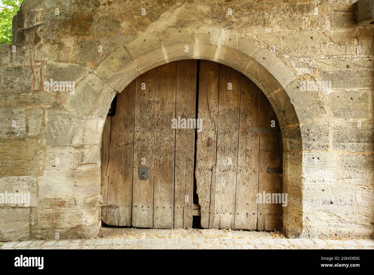An old wooden door, taken from the street, Rothenberg, Germany Stock Photo