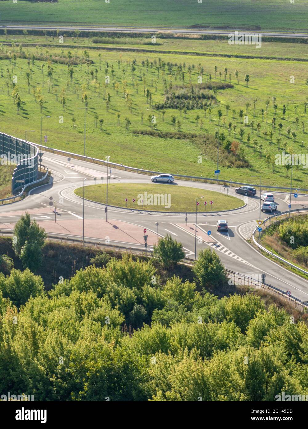 Green Traffic Roundabout Intersection in the summer. Stock Photo