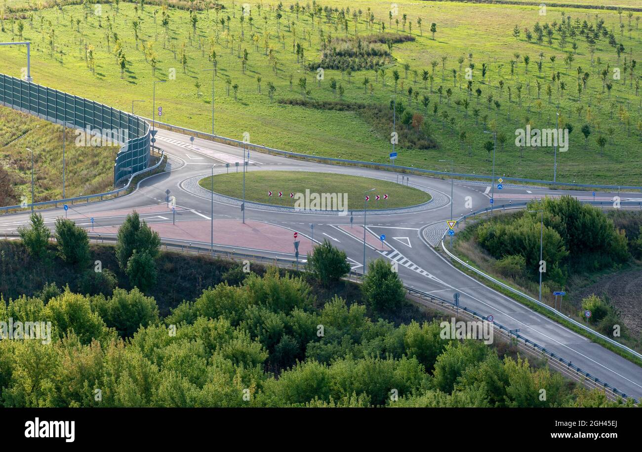 Green Traffic Roundabout Intersection in the summer. Stock Photo
