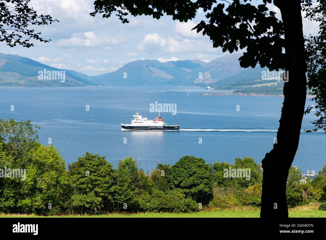 Isle of Bute - MV Argyle Calmac ferry approaching Rothesay as seen from Bogany Wood also known as Skippers Woods, Rothesay, Isle of Bute, Scotland, UK Stock Photo