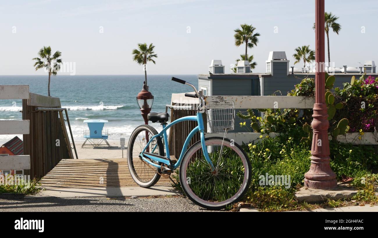 Blue bicycle, cruiser bike by ocean beach, pacific coast, Oceanside