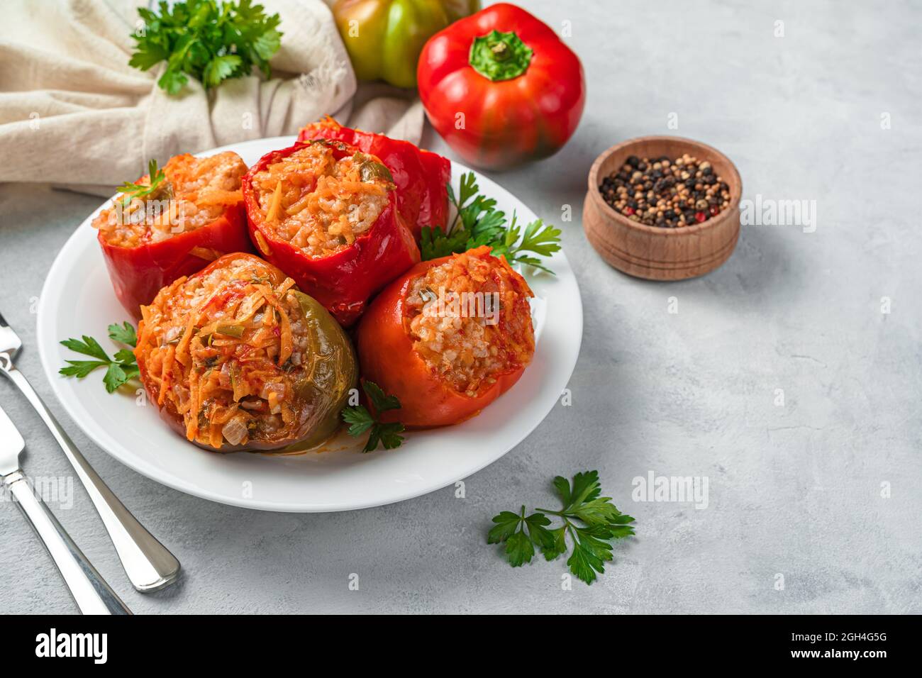 Bulgarian pepper stuffed with meat and rice with sauce on a gray ...