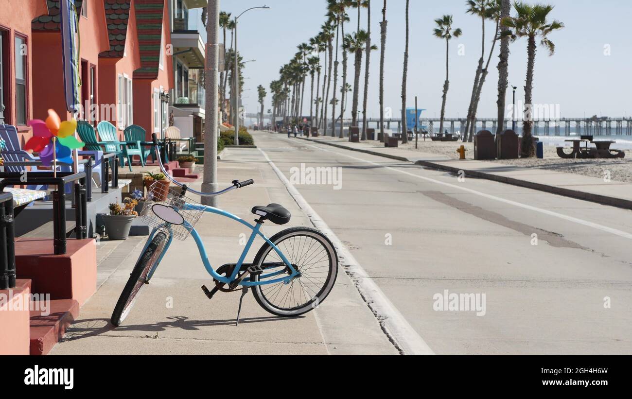 Blue bicycle, cruiser bike by ocean beach, pacific coast, Oceanside